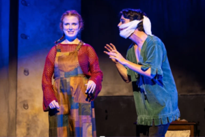 Lily Cascun on stage performing in The Grinning Man