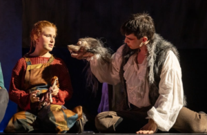 Lily Cascun on stage performing in The Grinning Man